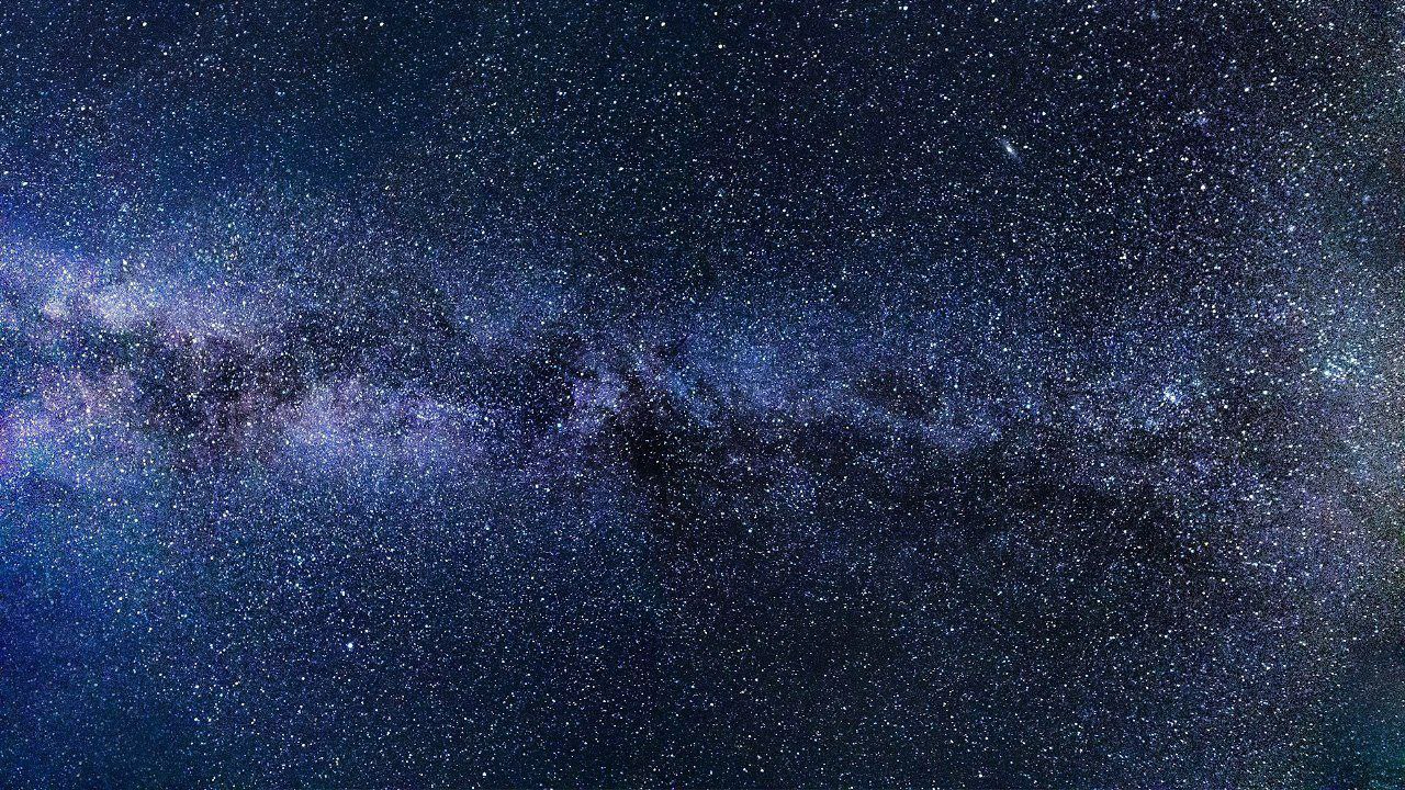 A galaxy with swirling stars and vibrant nebula